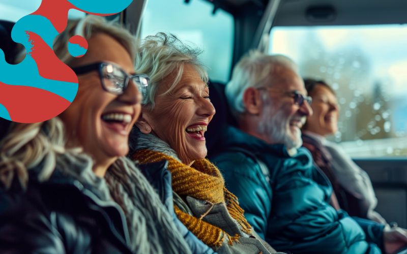 Group enjoying their journey on a coach charter smiling and laughing, group transport, May 2024, the United Kingdom.